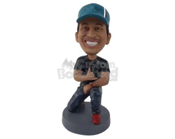 Man Kneeling on One Knee Giving Cool Sign, Wearing a Cap Personalized Bobblehead