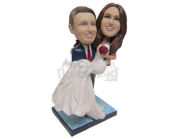 Custom Bobblehead Classy Groom Carrying Bride In His Arm Both In Wedding Attire - Wedding & Couples Bride & Groom Personalized Bobblehead & Cake Topper