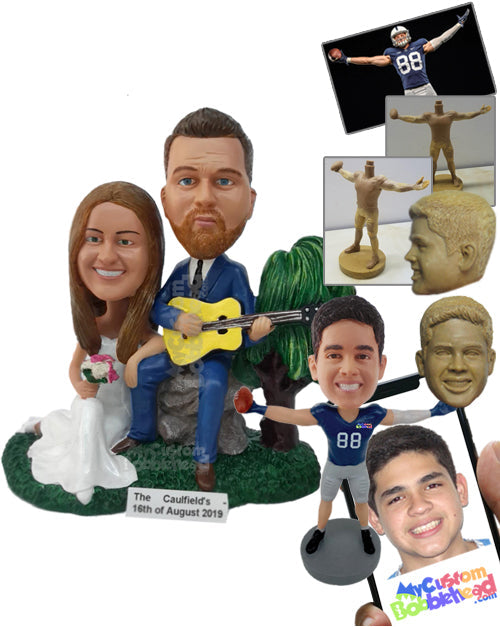 Man Sitting on a Rock Holding Guitar, Playing for His Wife Who Is Sitting Next to Him in a Gown Personalized Bobblehead