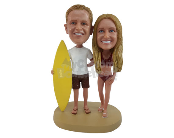 Surfing Couple, the Man Holding a Surfboard and the Woman Dressed Appropriately for the Beach Personalized Bobblehead