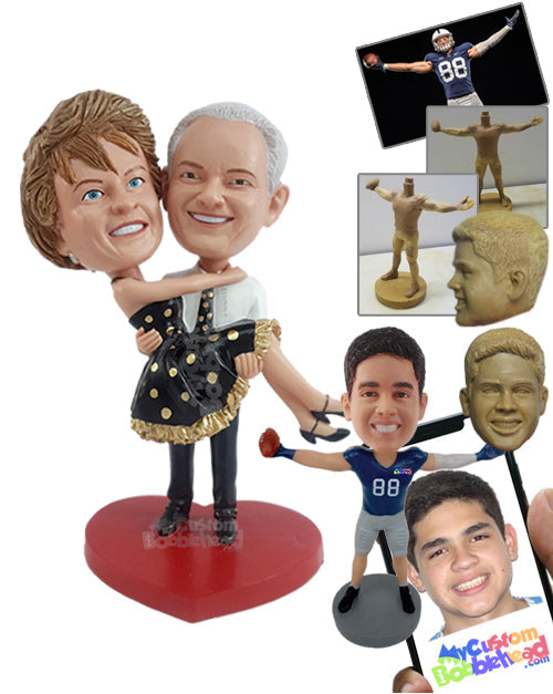 Lovely dance couple, male holding his dashing girl in his arms, wearing a nice dress Personalized Bobblehead