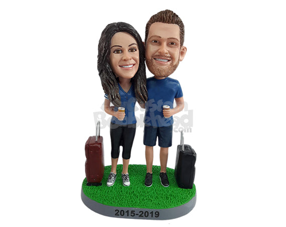 Sporty couple travelers holding coffee cups, wearing shorts Personalized Bobblehead