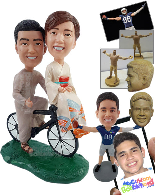 Traditional couple wearing nice robes and riding a bicycle Personalized Bobblehead