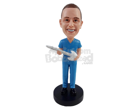 Chiropractor in Scrubs Holding a Spine Personalized Bobblehead