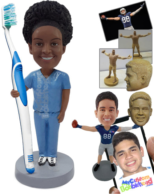 Nice dentist guy stretching his arm out to hold a real toothbrush, wearing scrubs Personalized Bobblehead