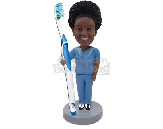 Nice dentist guy stretching his arm out to hold a real toothbrush, wearing scrubs Personalized Bobblehead