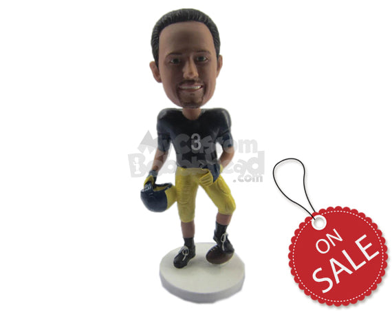 Custom Bobblehead Strong Football Player Giving A Pose With The Ball Under His Feet In Helmet In Hand - Sports & Hobbies Football Personalized Bobblehead & Cake Topper