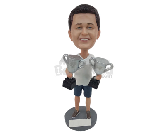 Charming Sports Aficionado Posing With 2 Trophies Personalized Bobblehead