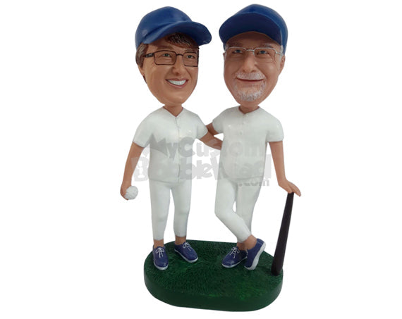 Two Baseball Players, One Leaning on Bat While Other Holding Ball in Hands Personalized Bobblehead