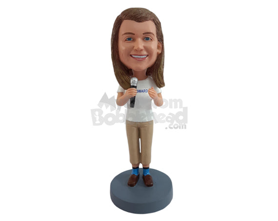 Custom Bobblehead Happy girl presenting helself to the audience wearing t-shirt and slacks holding a mic - Sports & Hobbies Coaching & Refereeing Personalized Bobblehead & Action Figure