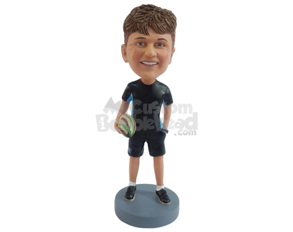 Rugby fan holding a ball, hand in shorts pocket Personalized Bobblehead