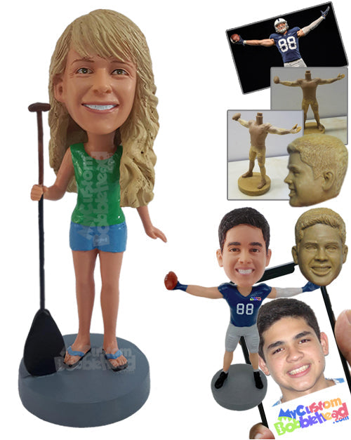 Girl Holding a Paddle Board, Wearing a Sleeveless Shirt and Shorts on a Hot Day Personalized Bobblehead