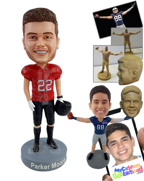 Young football player pal posing cool for the teams photo holding his helmet on one hand Personalized Bobblehead