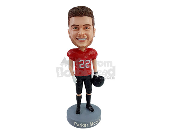 Young football player pal posing cool for the teams photo holding his helmet on one hand Personalized Bobblehead