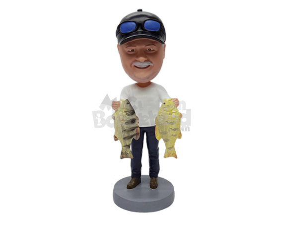 Fisherman Holding 2 Fish, One in Each Hand, Wearing a T-shirt and Pants Personalized Bobblehead