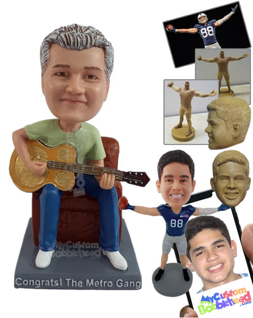 Male playing a banjo-like guitar, sitting on a chair, wearing a round neck t-shirt Personalized Bobblehead