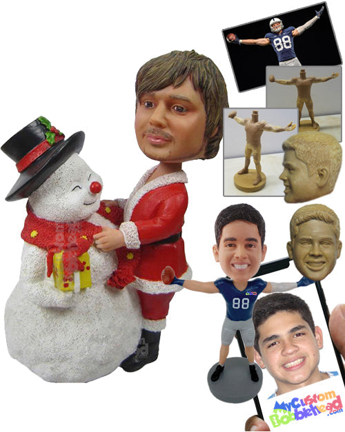 Man Wearing Santa Claus Outfit Posing with a Snowman Personalized Bobblehead